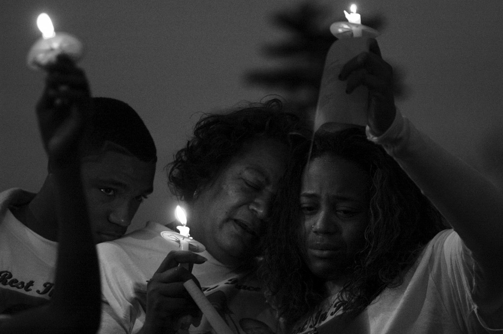 Baltimore family lights candles for dead teen's brithday